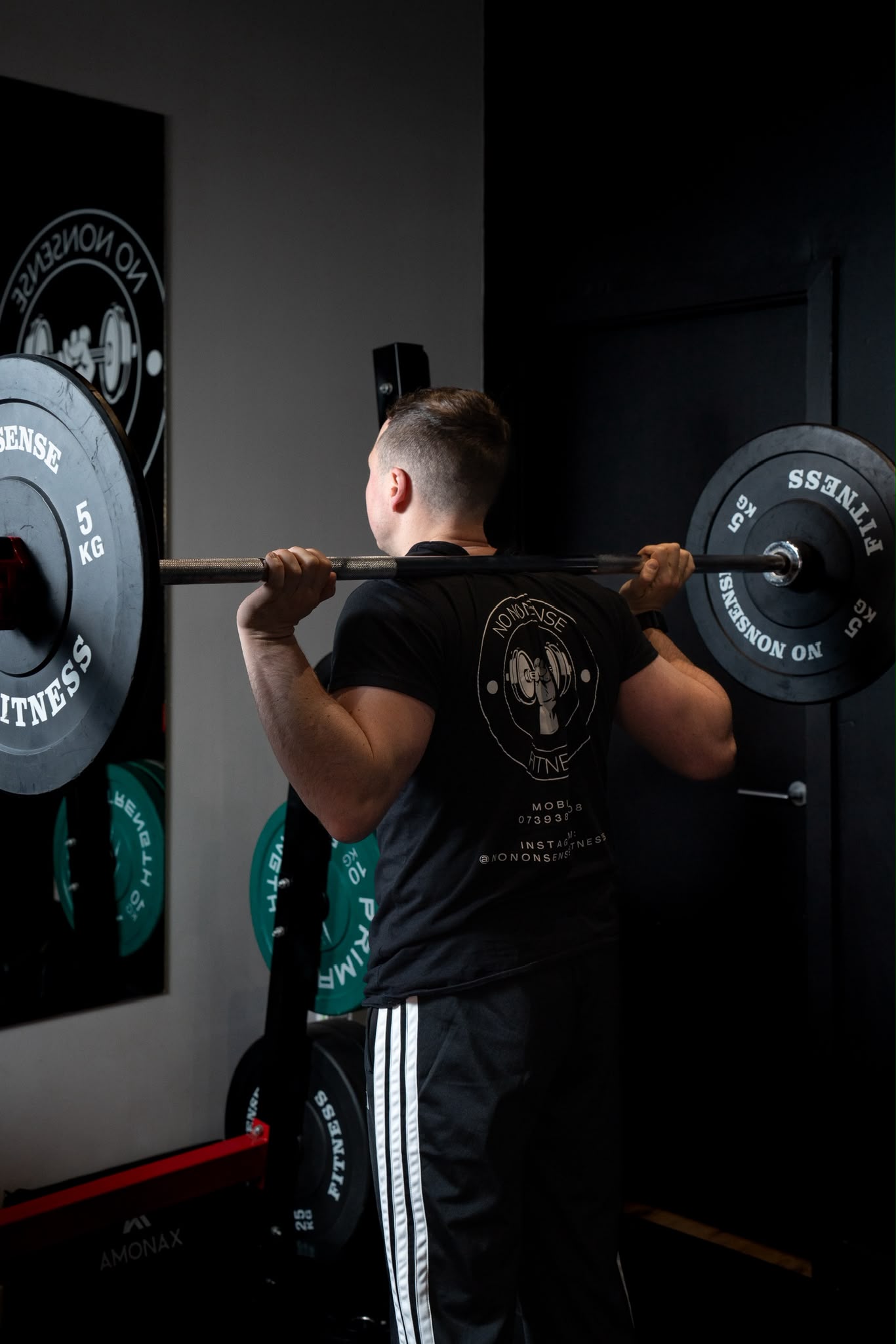 Jason preparing for a barbell back squat